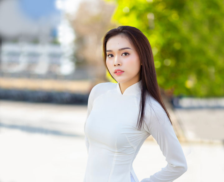 Chinese woman wearing white long sleeve dress